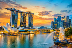 Beautiful view of Marina Bay Sands, Merlion Park, and Singapore skyline during sunset.